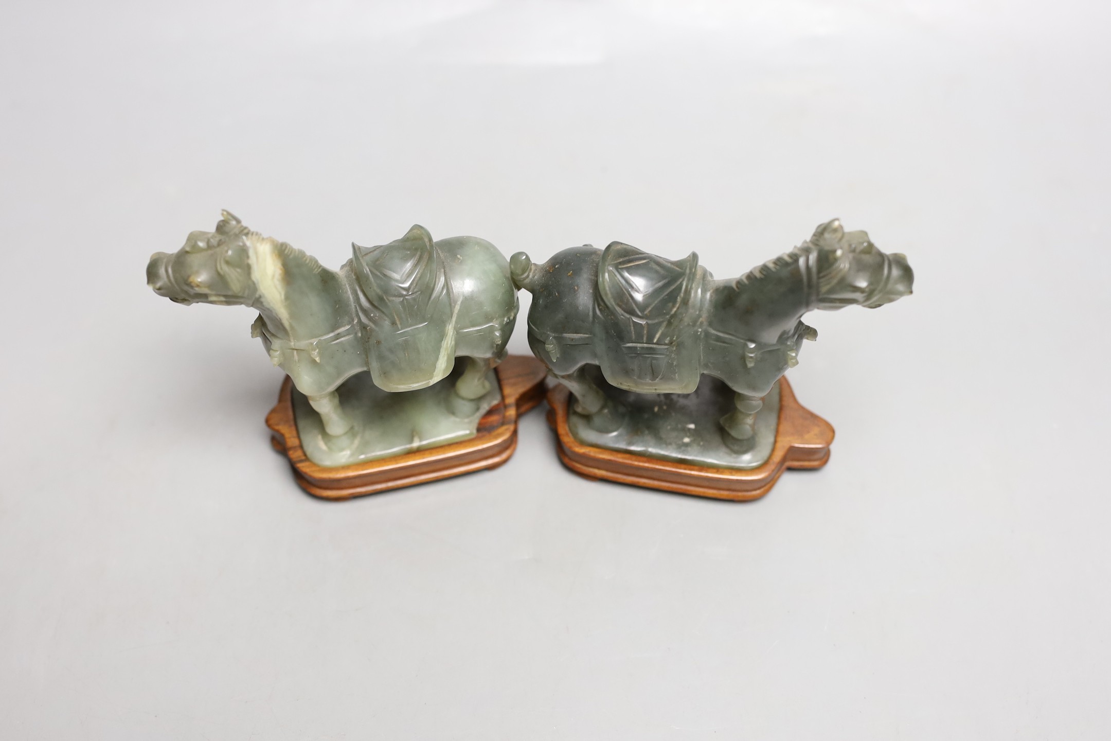 A pair of 20th century Chinese celadon jade figures of horses - 12cm tall